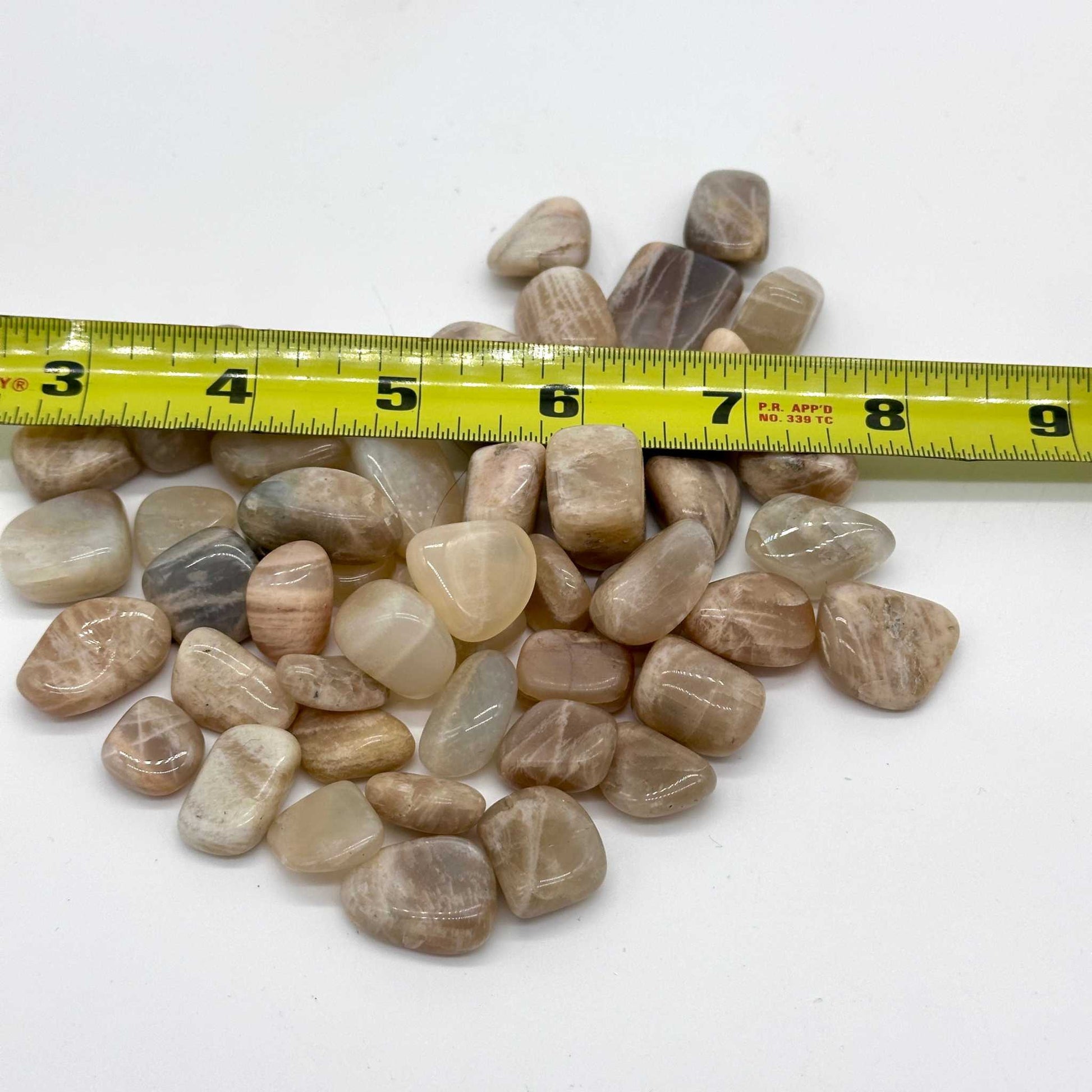 Multi-color Moonstone tumbled stone shown from a second angle with silvery sheen