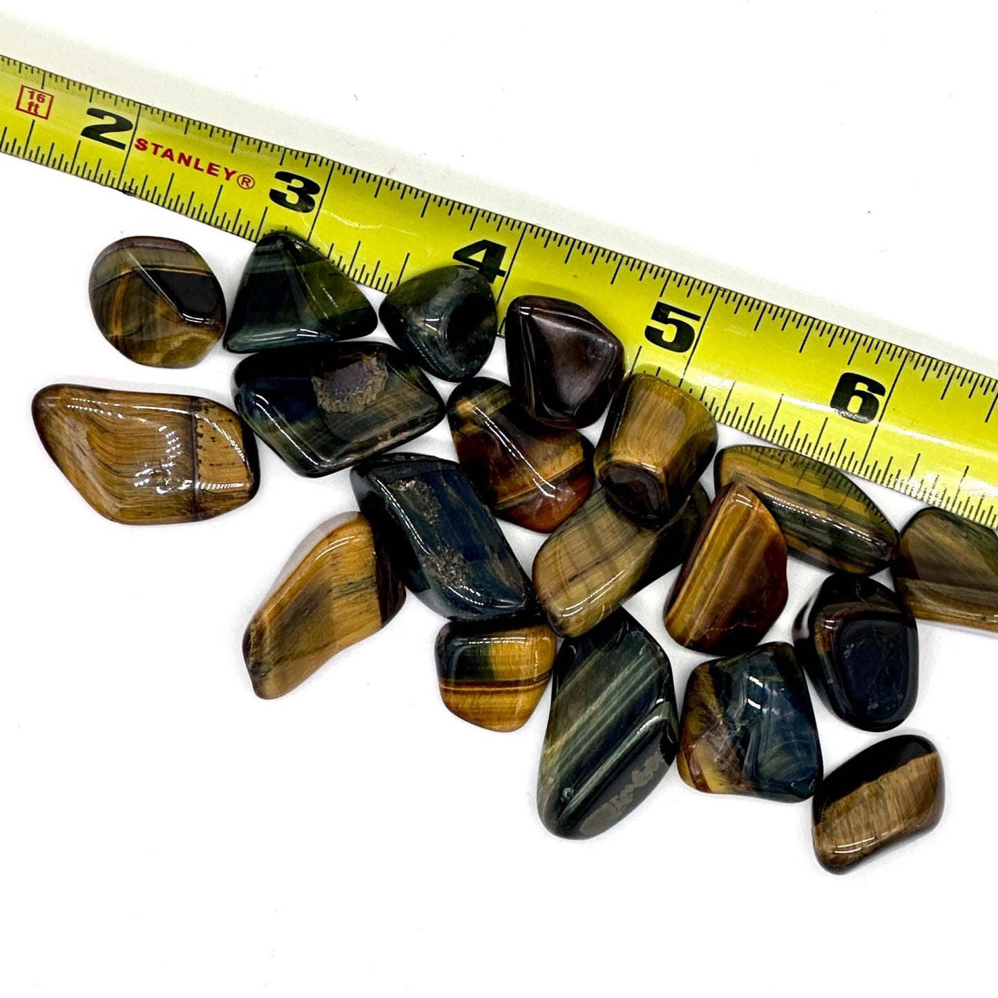 Polished blue tiger eye hawk's eye tumbled pocket stone with blue-grey chatoyant bands — shown from a second angle