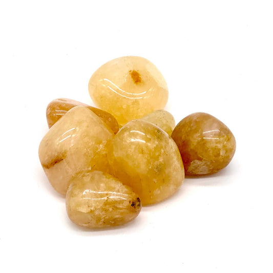 Polished Golden Healer Quartz tumbled stone with warm golden iron-oxide coloring