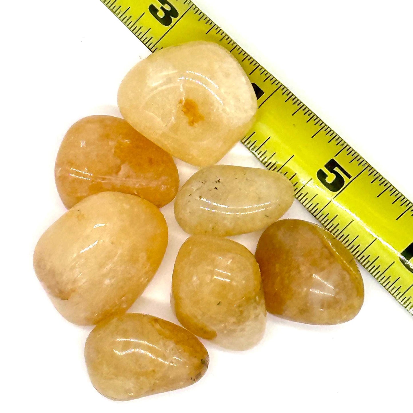 Polished Golden Healer Quartz tumbled stone with warm golden iron-oxide coloring — shown from a second angle