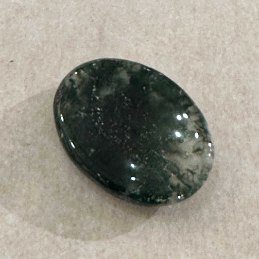 Moss agate comfort stone with green dendritic inclusions in translucent stone