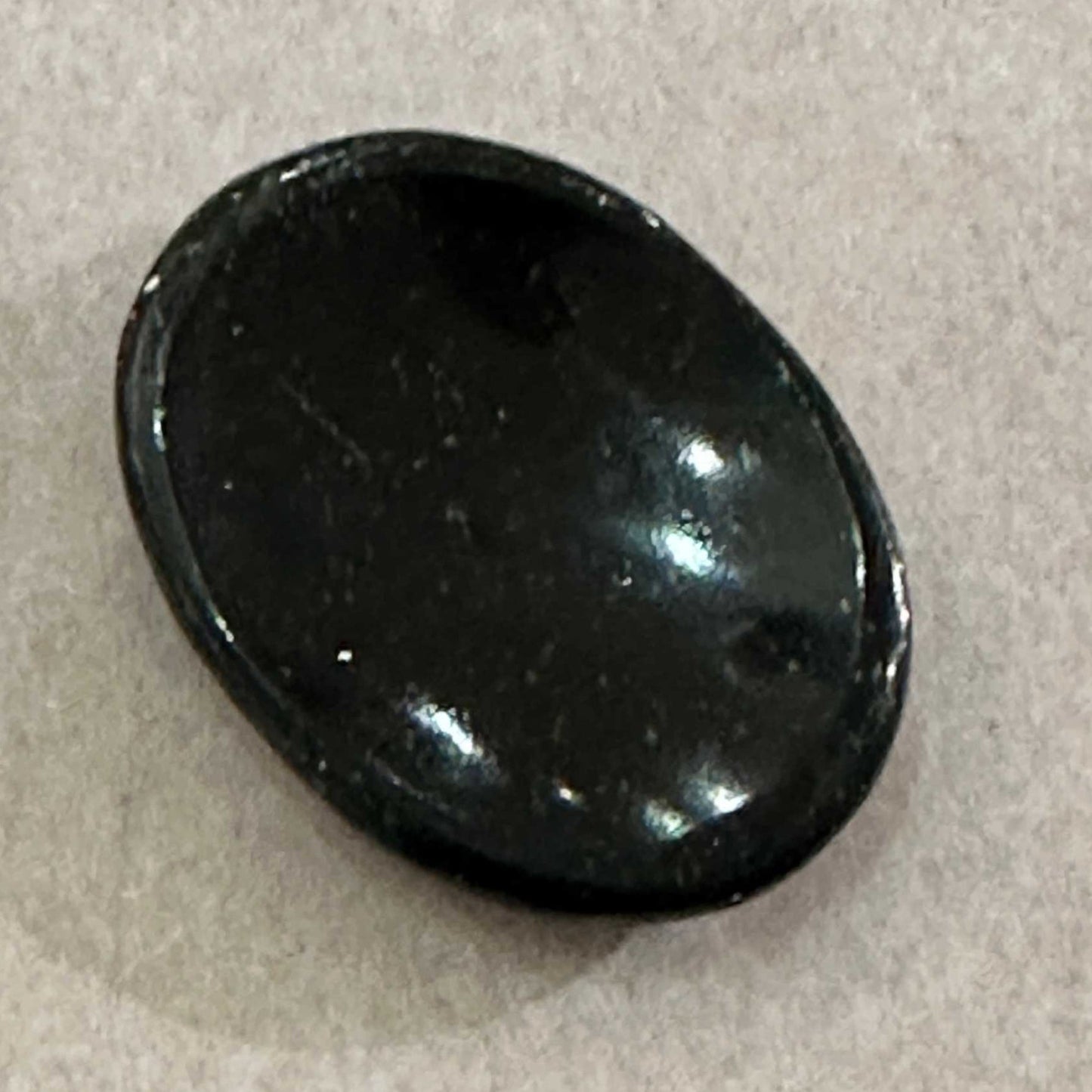 Deep green goldstone comfort stone glittering with copper flecks