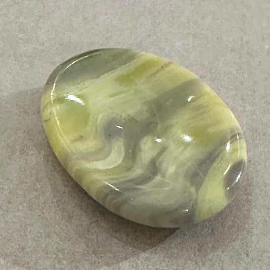 Smooth green Serpentine comfort stone with swirling sage and forest tones