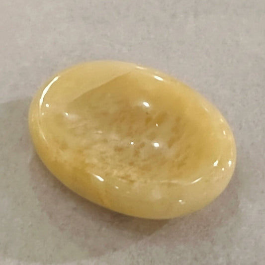 Smooth oval golden aventurine comfort stone with shimmering mica inclusions