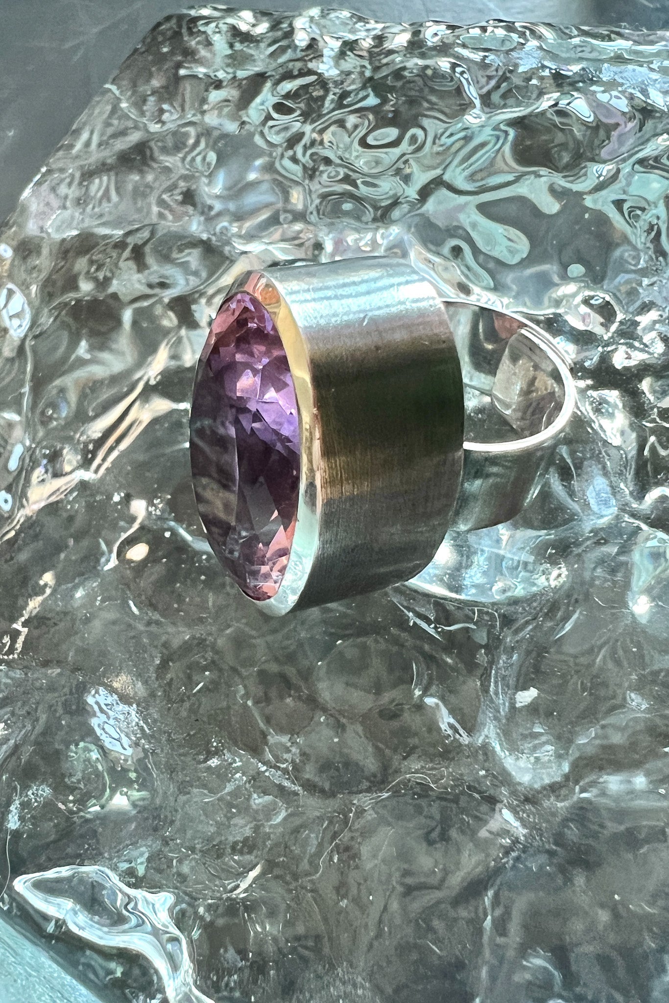 A statement ring with a carved azalea pink glass stone in a tall oxidized silver setting — additional product view 3.