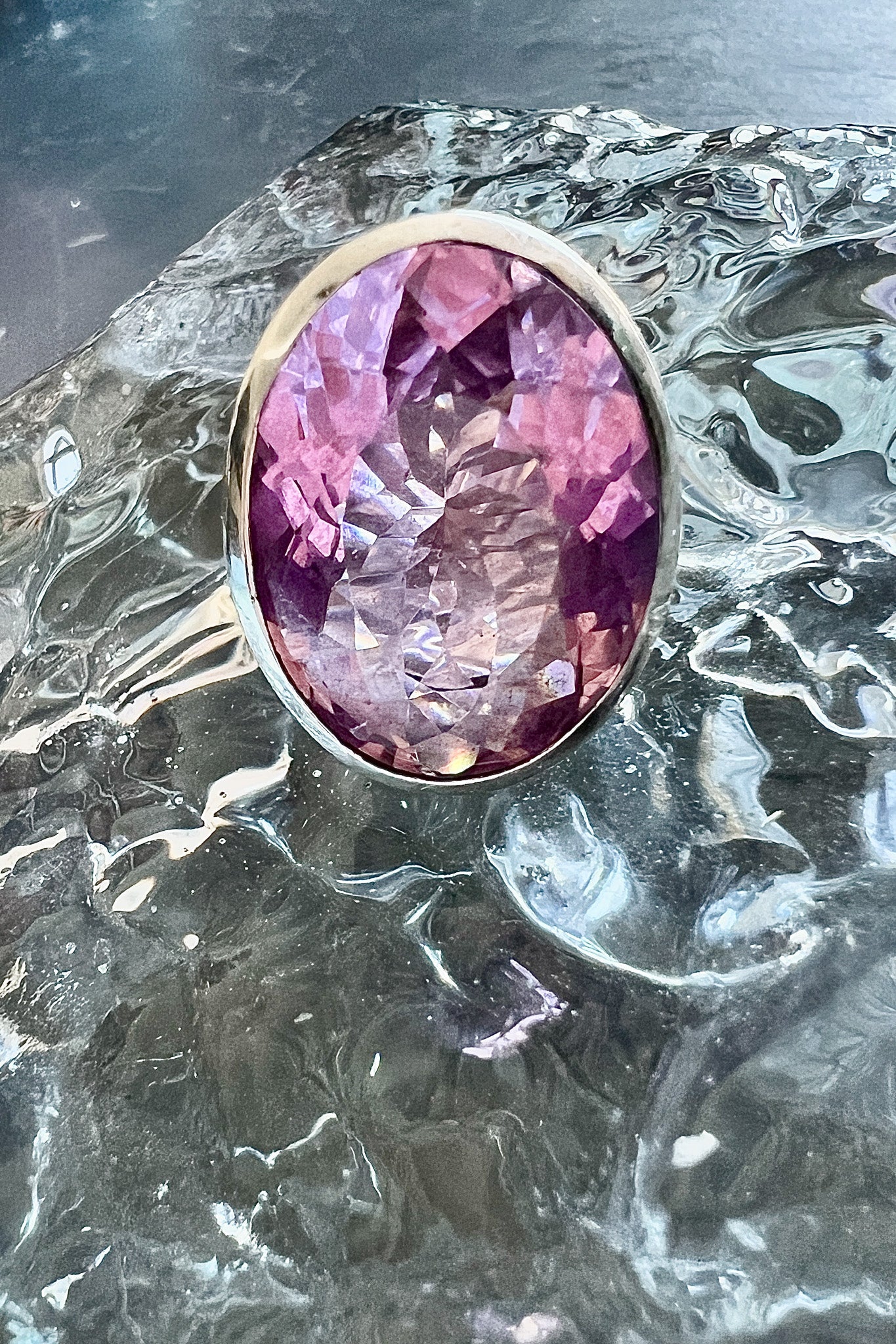 A statement ring with a carved azalea pink glass stone in a tall oxidized silver setting — additional product view 4.
