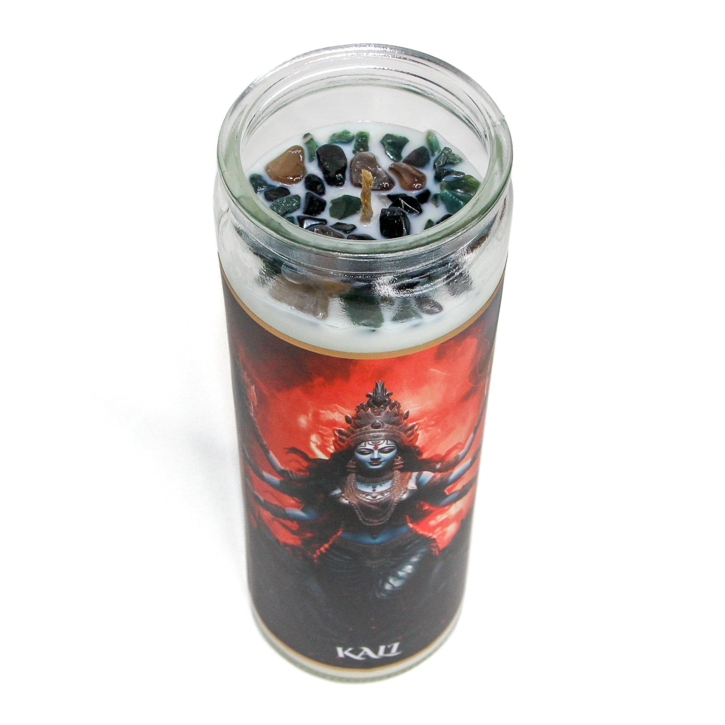 The Kali altar candle lit, showing the flame and melt pool
