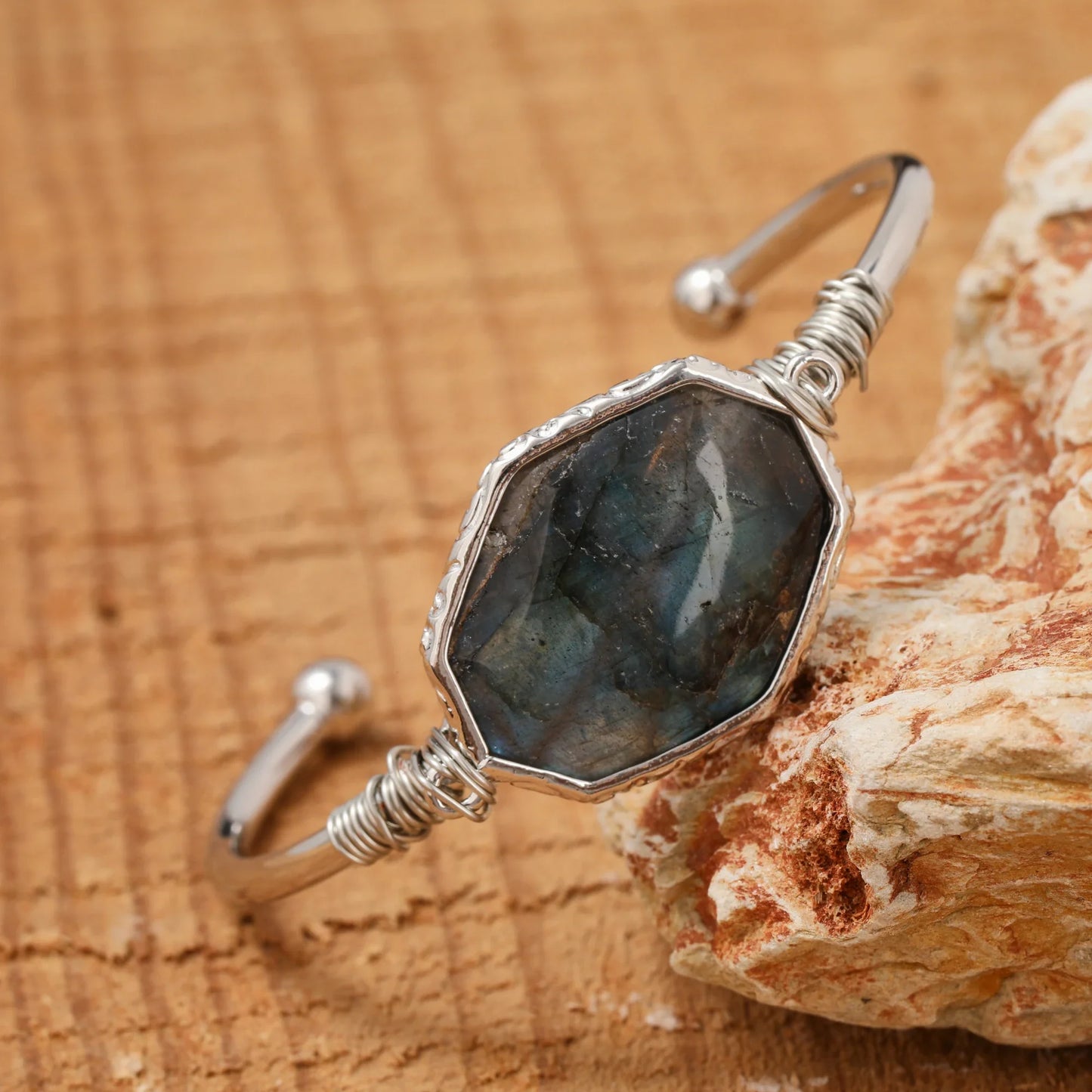 Open bangle cuff bracelet set with a large octagonal labradorite stone showing blue and green flash — product photo 3