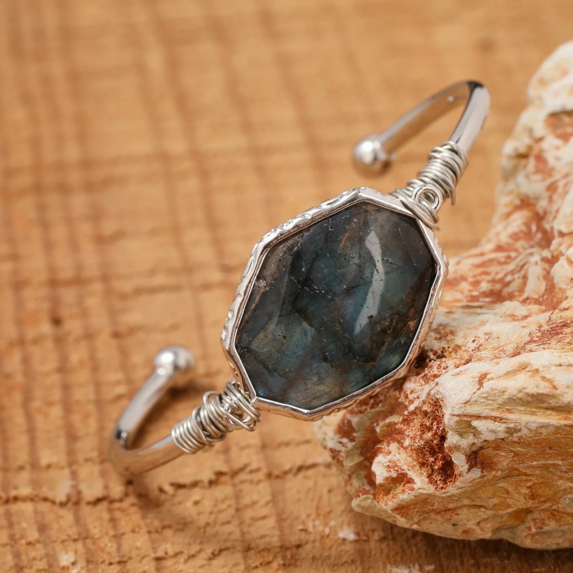 Open bangle cuff bracelet set with a large octagonal labradorite stone showing blue and green flash — product photo 3