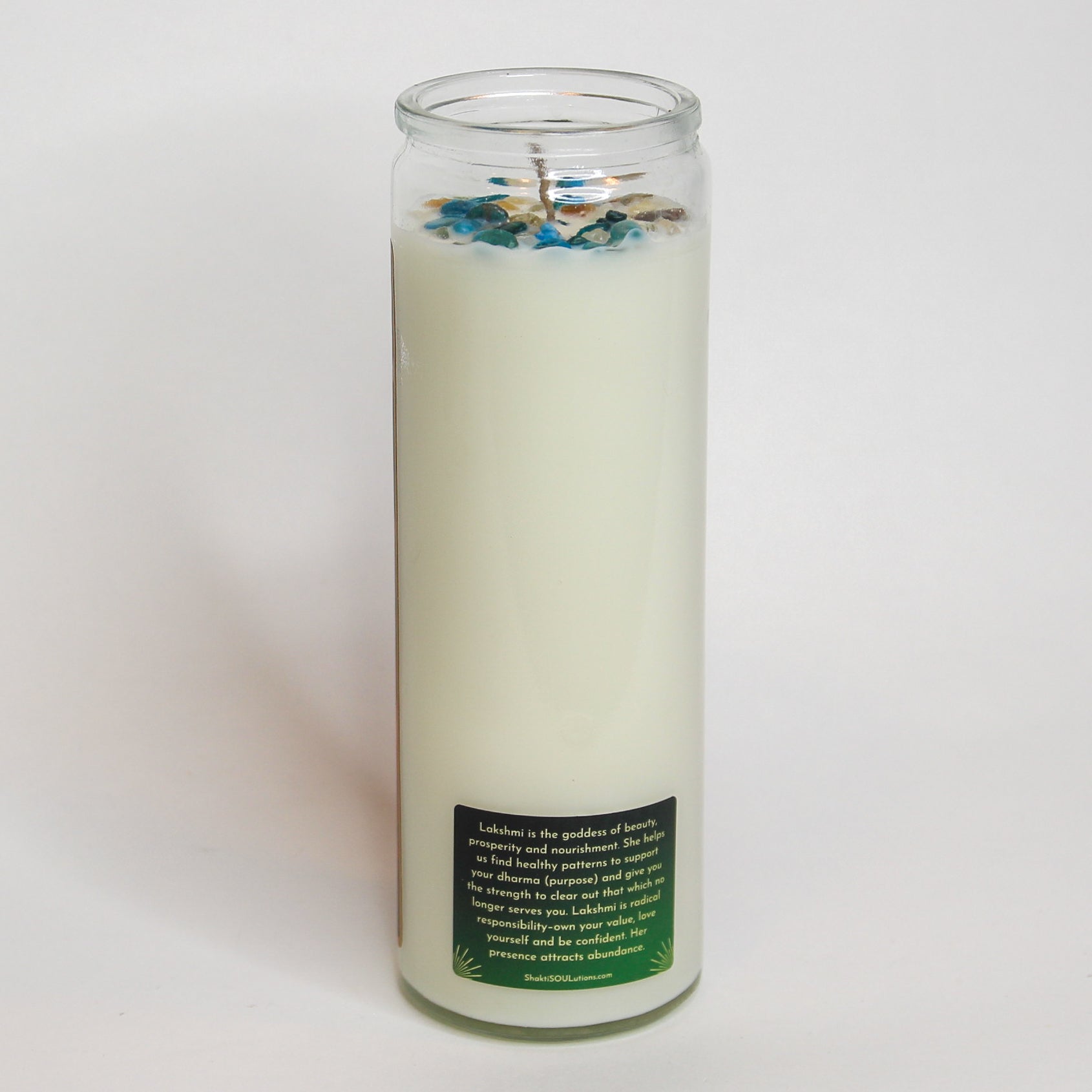 Lakshmi Crystal Altar Candle in a 16 oz glass tumbler with an image of the goddess Lakshmi on the label and golden crystals set into the wax — product photo 5