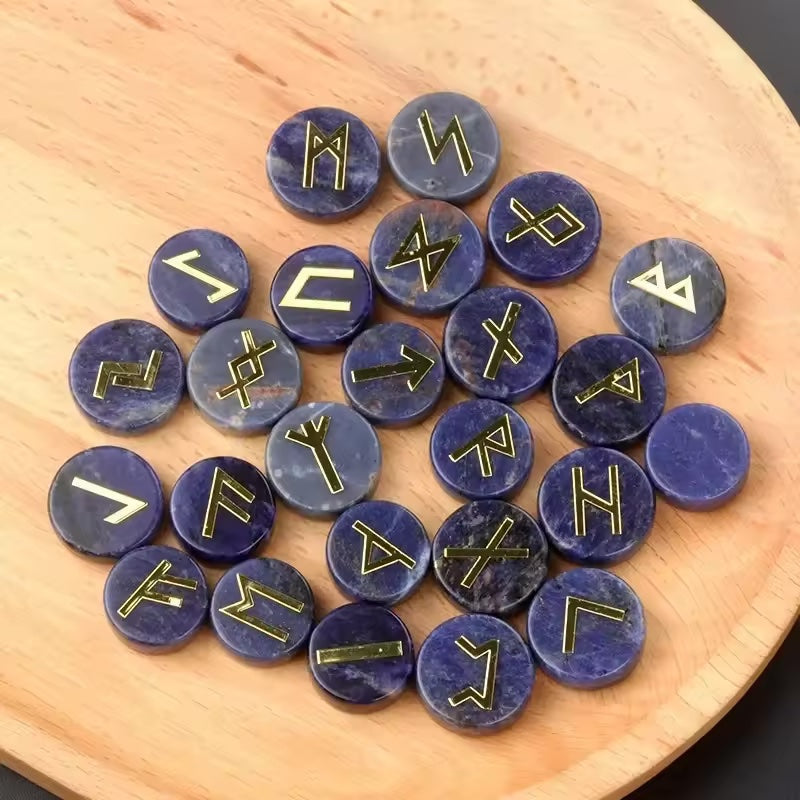 Set of round polished crystal runes engraved with runic symbols, scattered on a dark surface — view 3 of 12