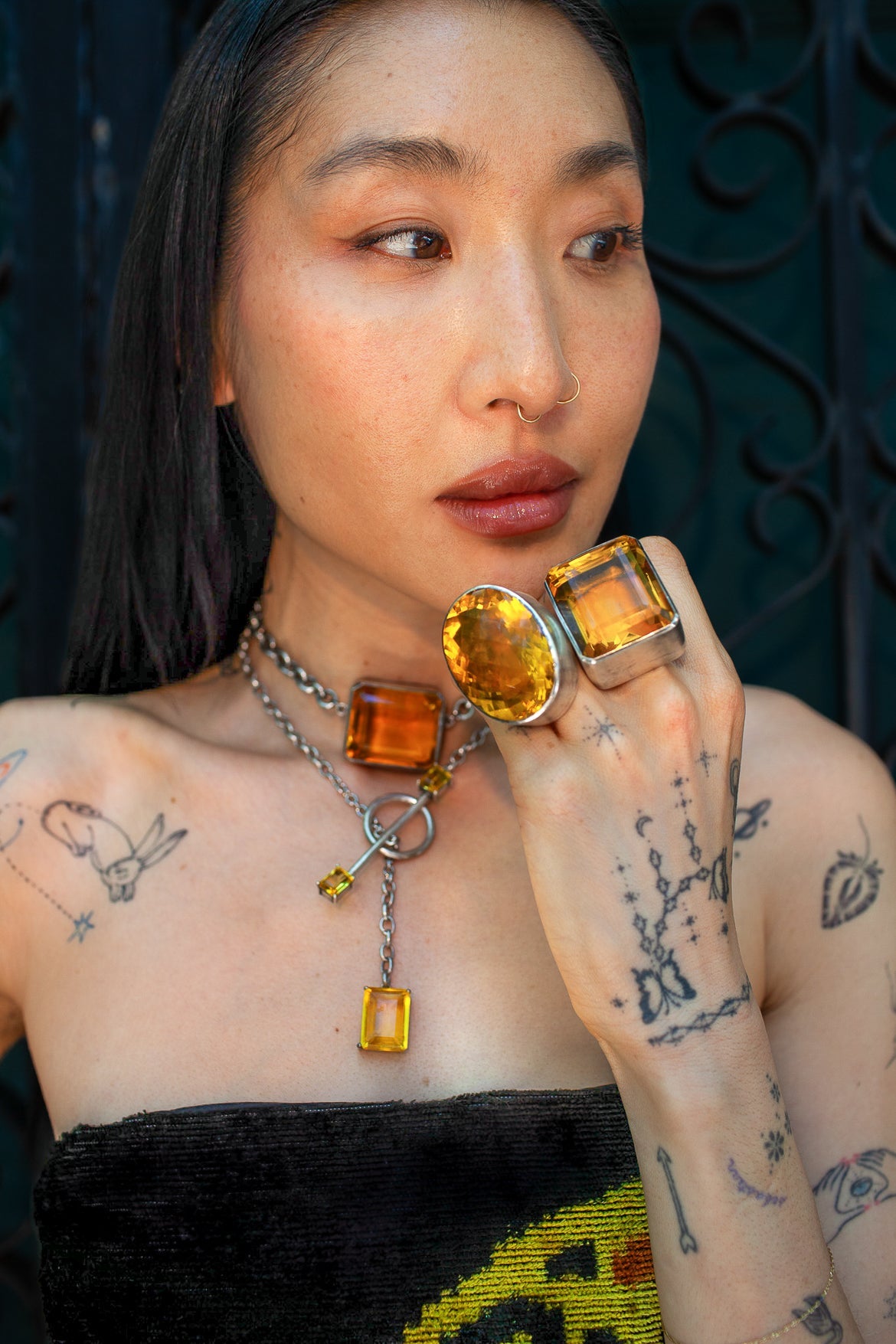 Oval Colossus Ring in Golden — oversized faceted golden yellow glass oval in a tall setting on a thick oxidized silver band — view 4