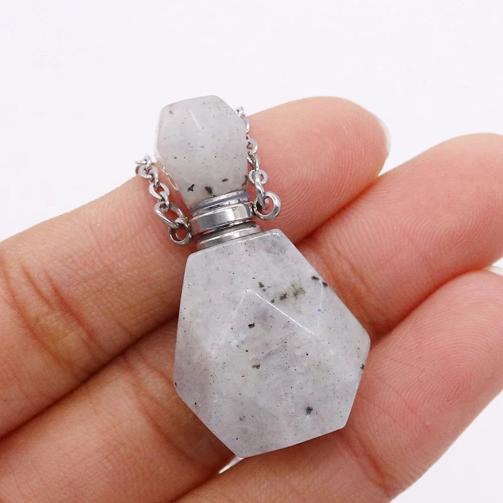 Small glass potion bottle pendant filled with crystals on a stainless steel chain — view 8 of 12