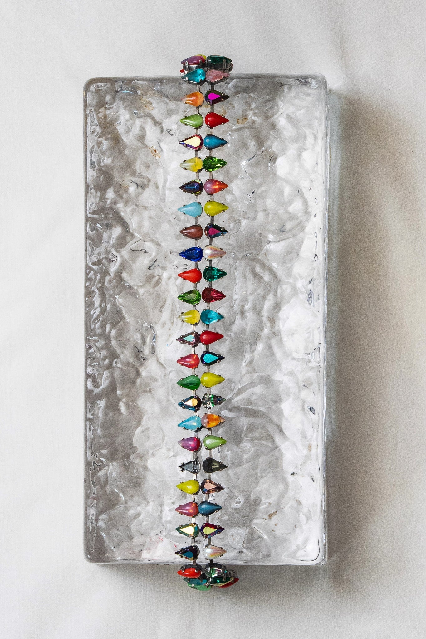 Detail of double-layered mini fang-shaped glass stones