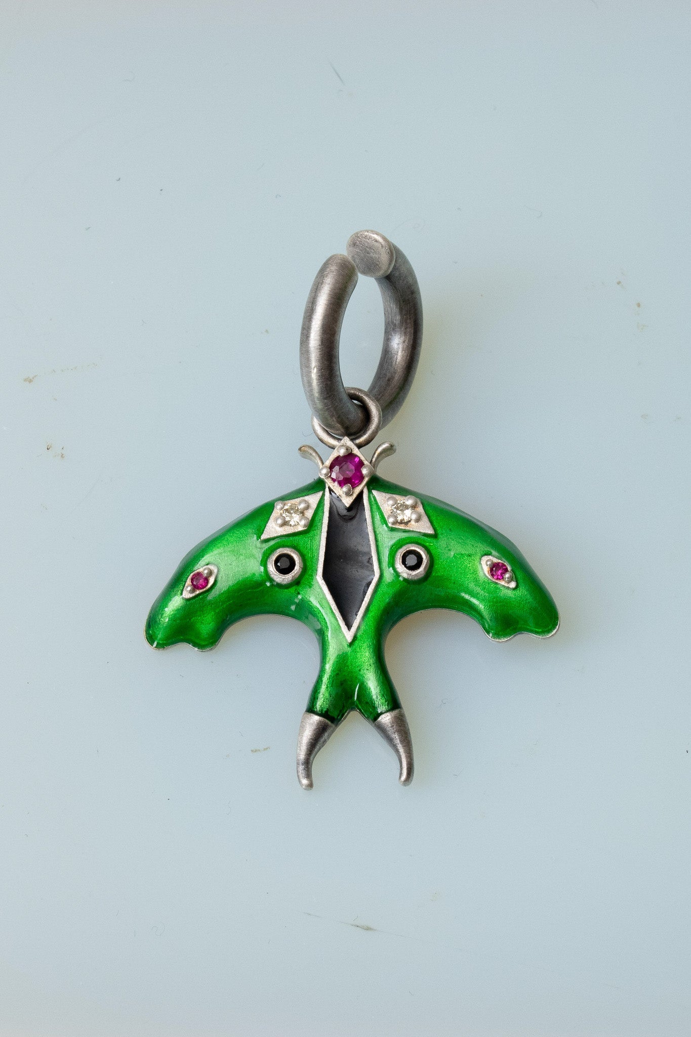 Luna moth enamel ear cuff in oxidized silver, side view