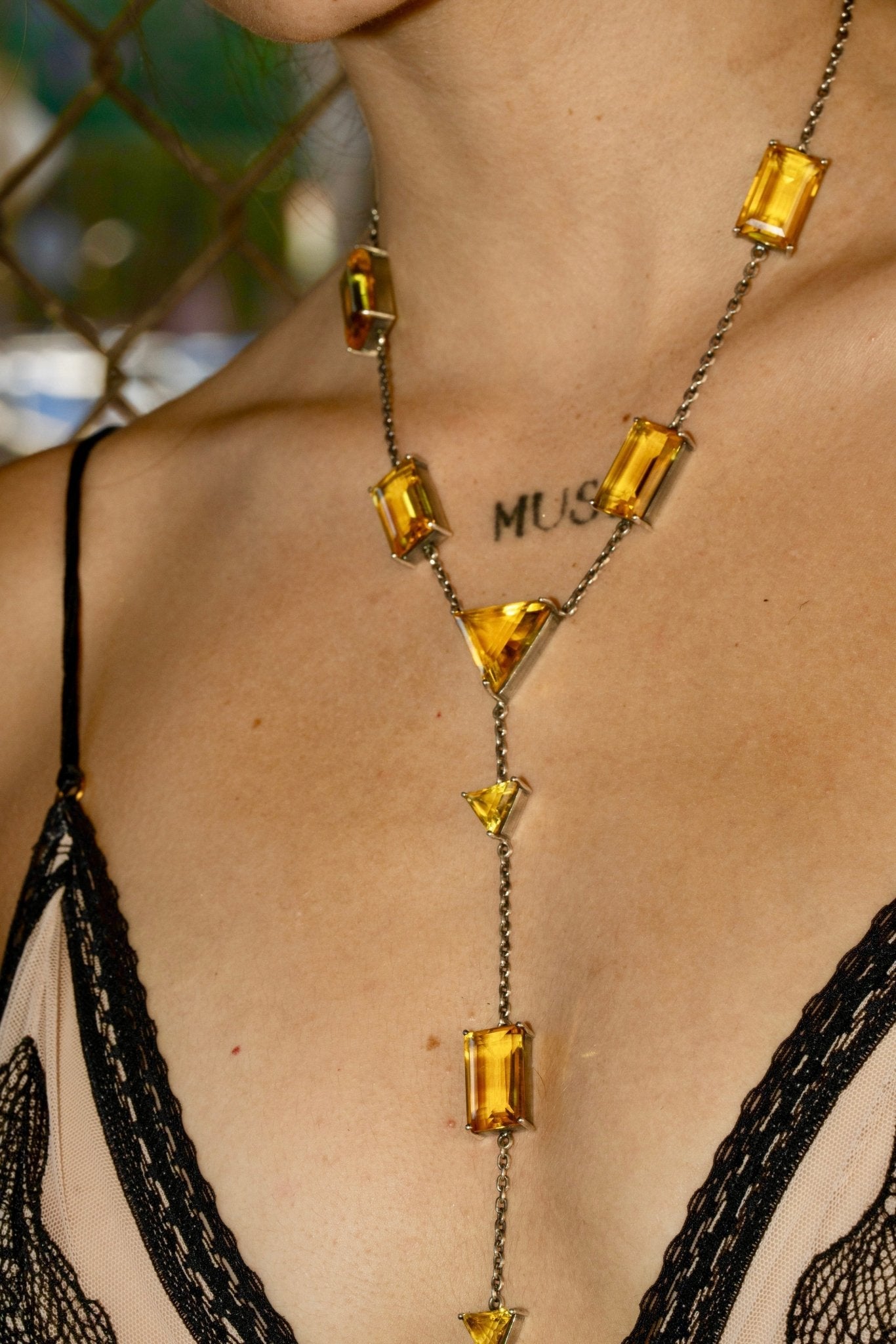 Slink Y-Chain in Golden — thin oxidized silver cable chain strung with luminous golden yellow glass in a Y-drop silhouette — view 3