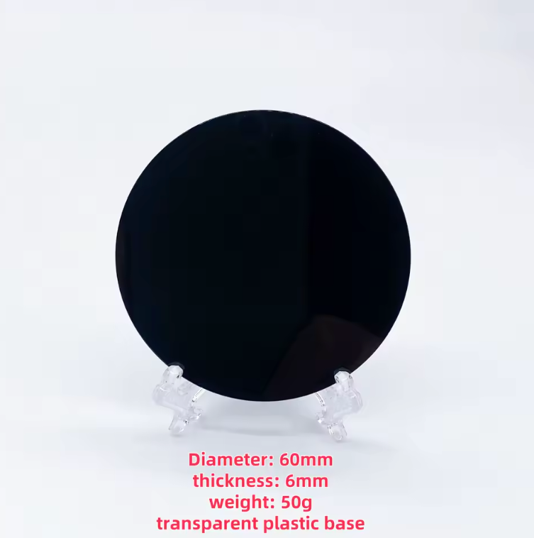 Round polished black obsidian scrying mirror resting on its base stand — view 8 of 11