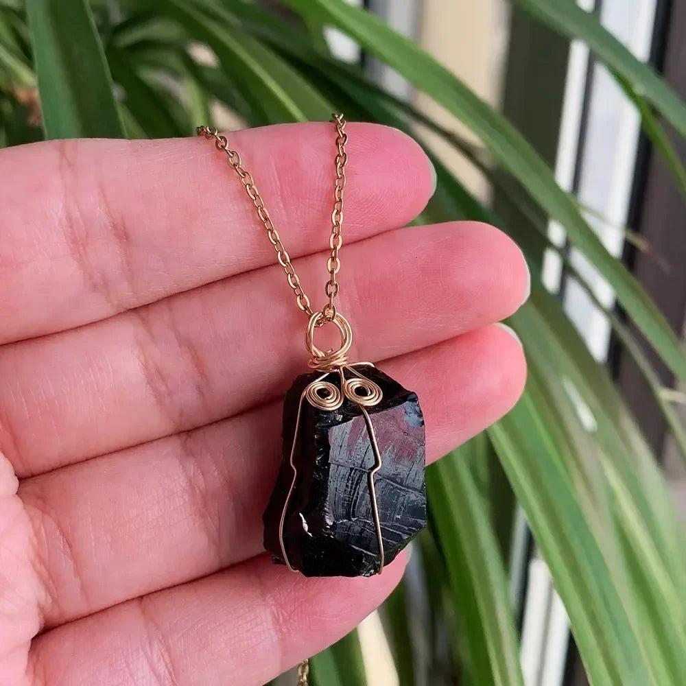 Raw wire-wrapped crystal pendant on a gold-plated stainless steel link chain — view 7 of 20