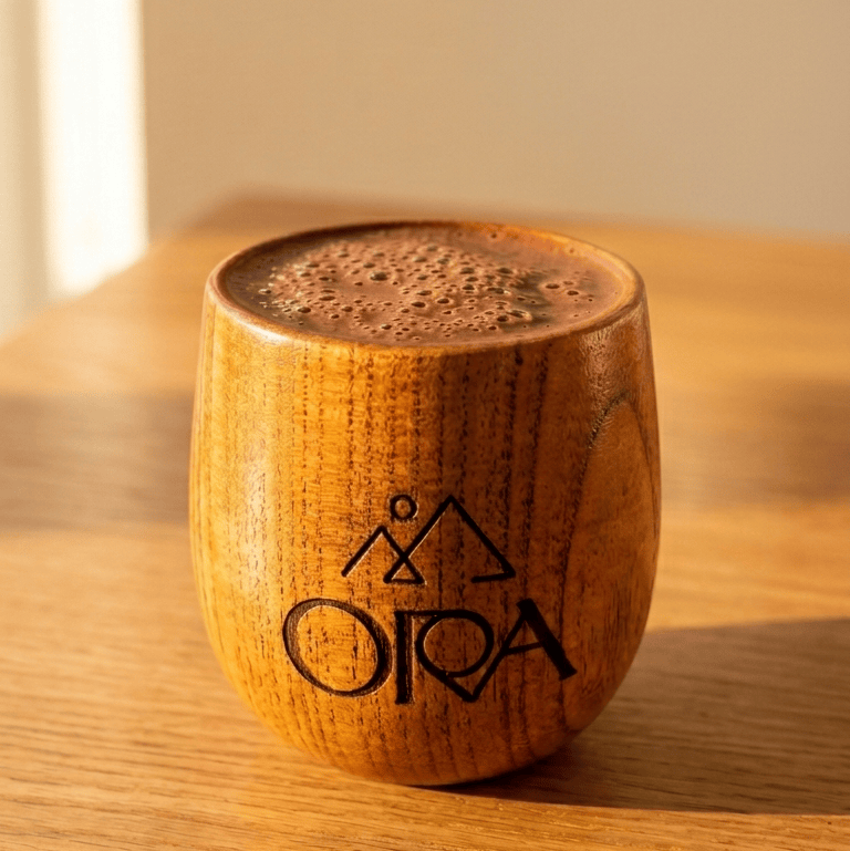 Laser-engraved wooden Ora Cacao ceremony cup shown on a plain neutral background.