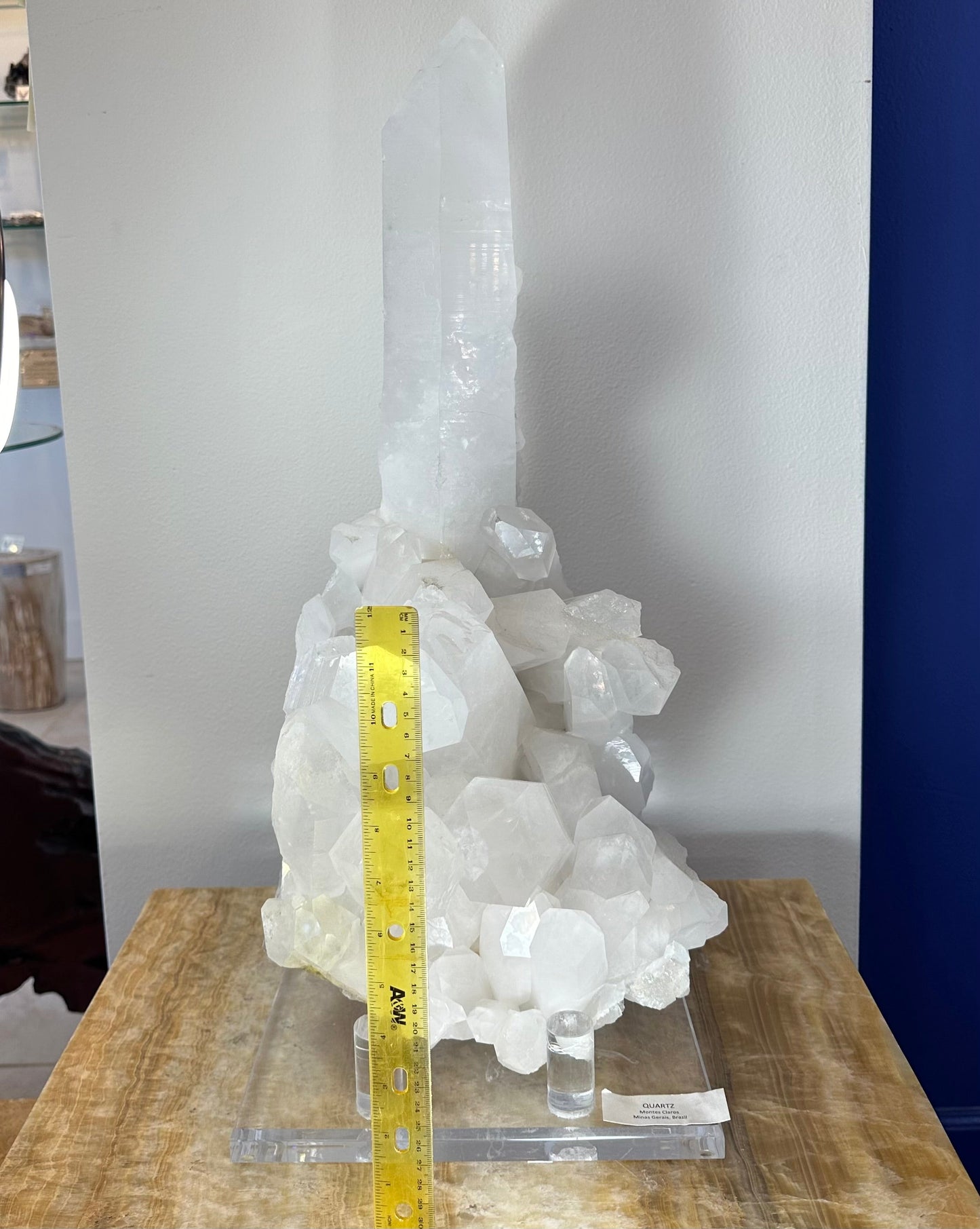 Side view of the large quartz cluster on its custom stand
