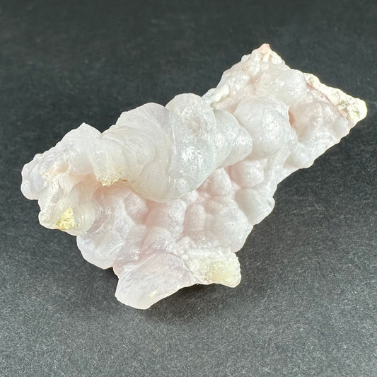 Botryoidal pink opal specimen from Ica, Peru, with rounded bubble-like formations in soft matte pink