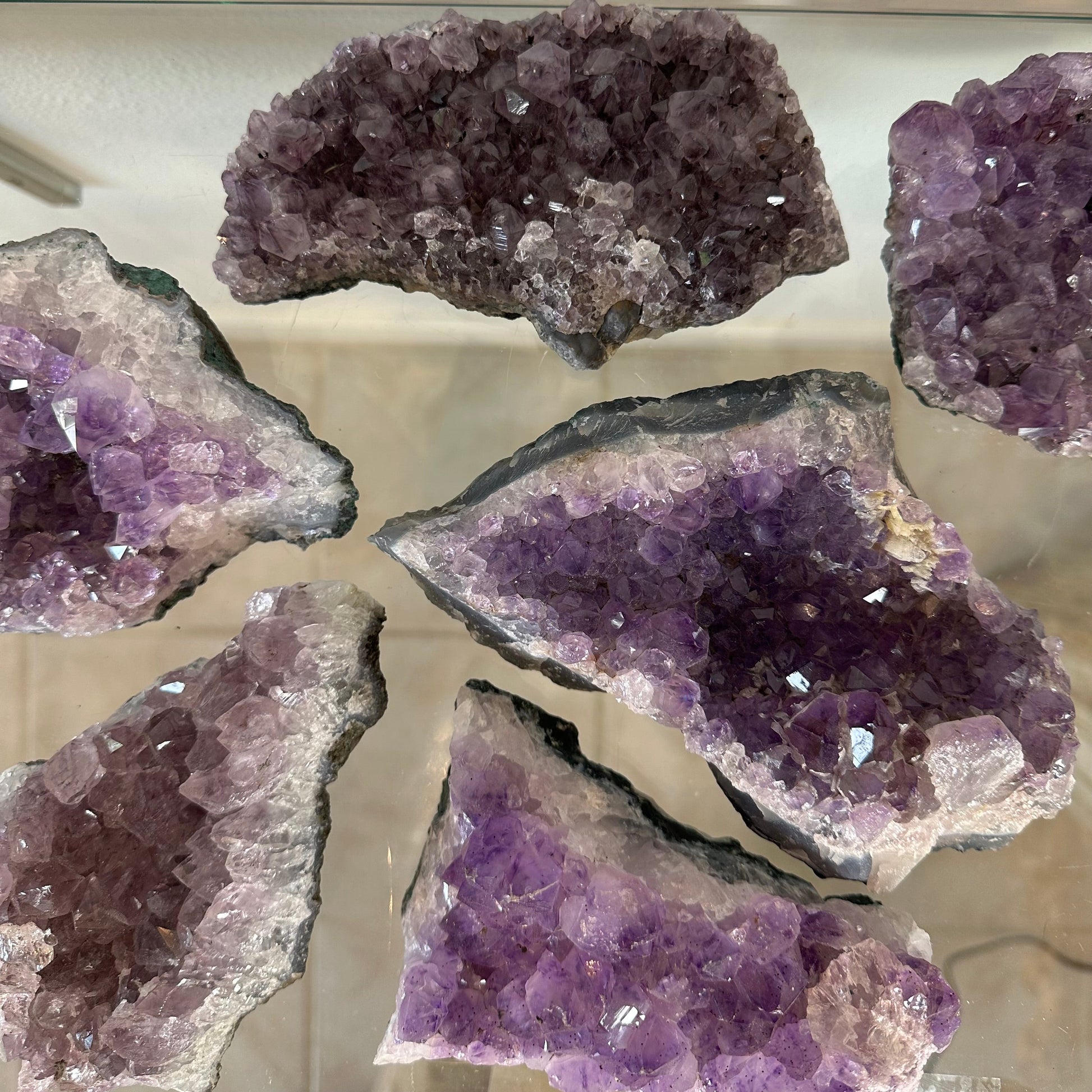 Raw Brazilian amethyst druze piece with a crust of purple crystal points