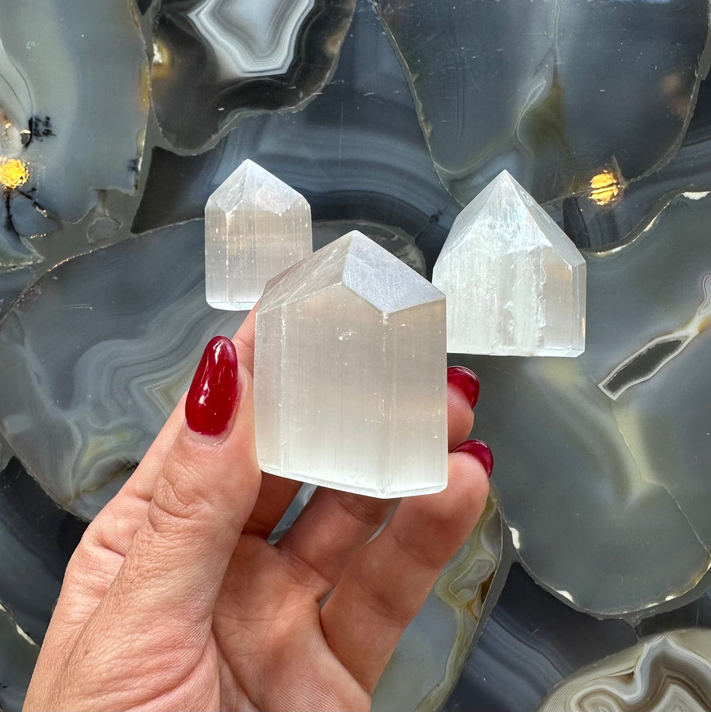 Small translucent white selenite obelisk tower from Morocco, four-sided point about two inches tall — view 2