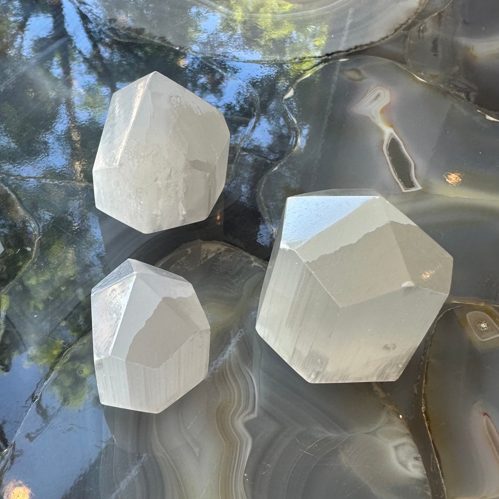 Small translucent white selenite obelisk tower from Morocco, four-sided point about two inches tall — view 3