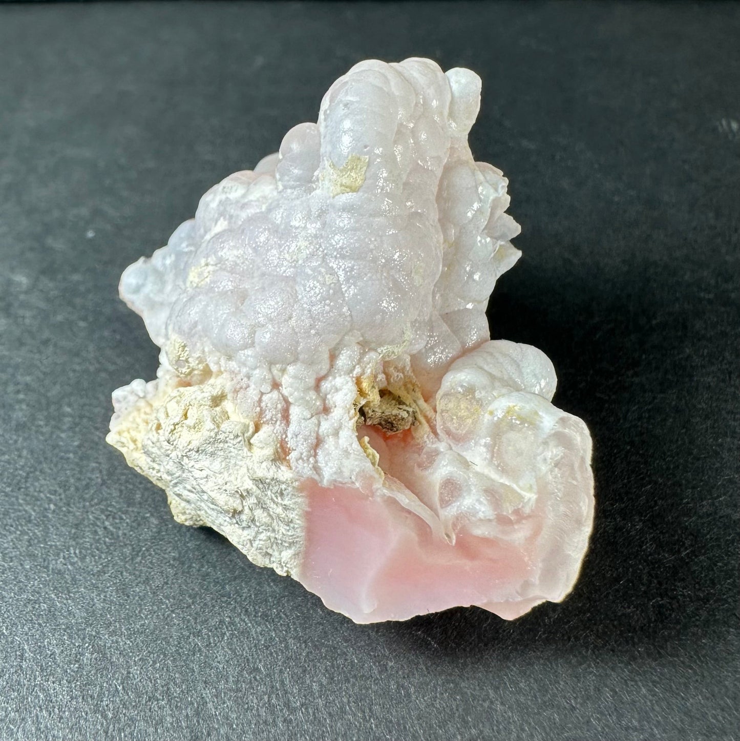 Botryoidal pink opal specimen from Ica, Peru, with rounded bubble-like formations in soft matte pink — view 4