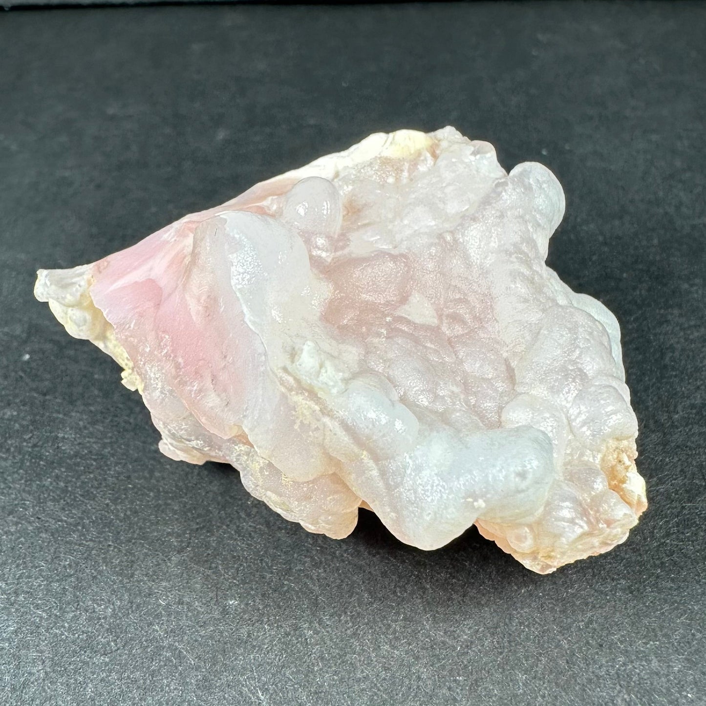 Botryoidal pink opal specimen from Ica, Peru, with rounded bubble-like formations in soft matte pink — view 11