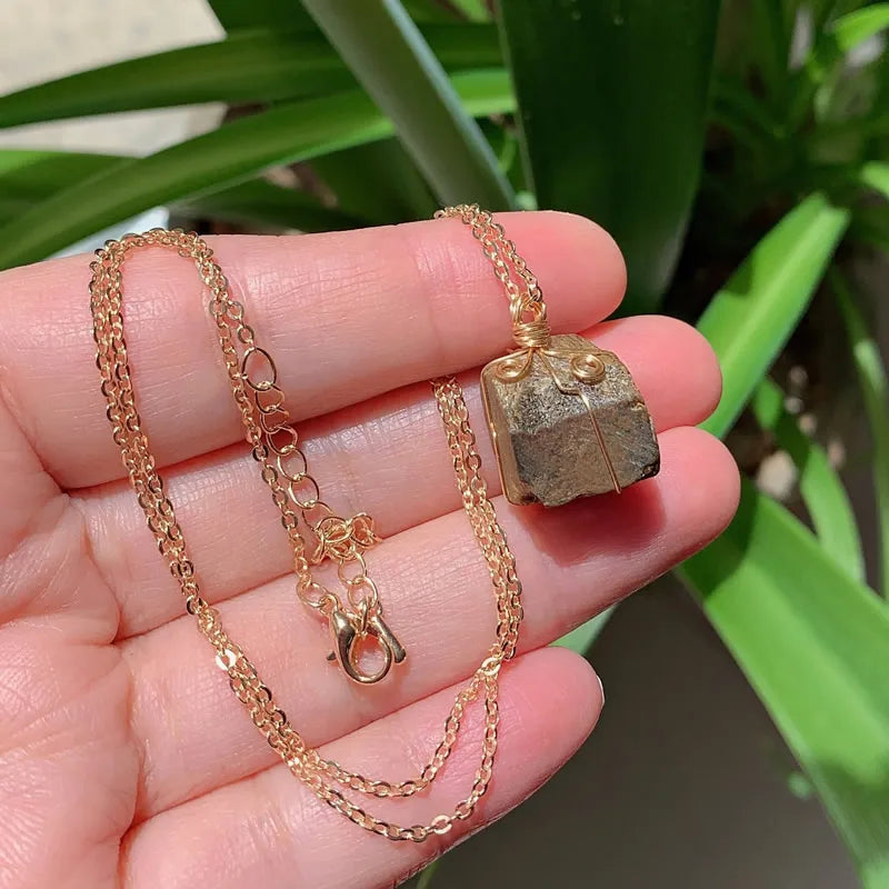 Raw wire-wrapped crystal pendant on a gold-plated stainless steel link chain — view 20 of 20