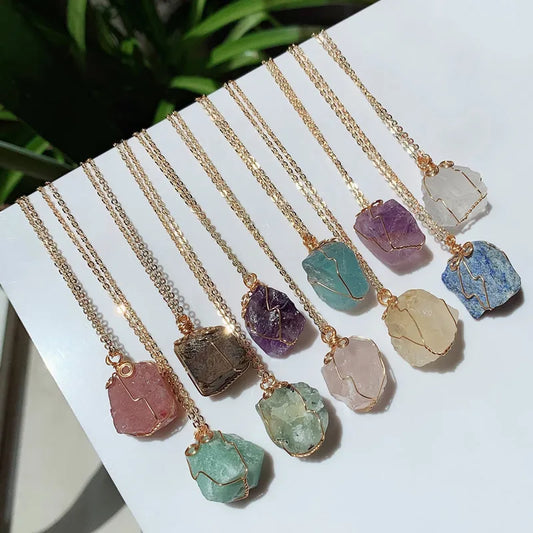 Raw wire-wrapped crystal pendant on a gold-plated stainless steel link chain — view 1 of 20
