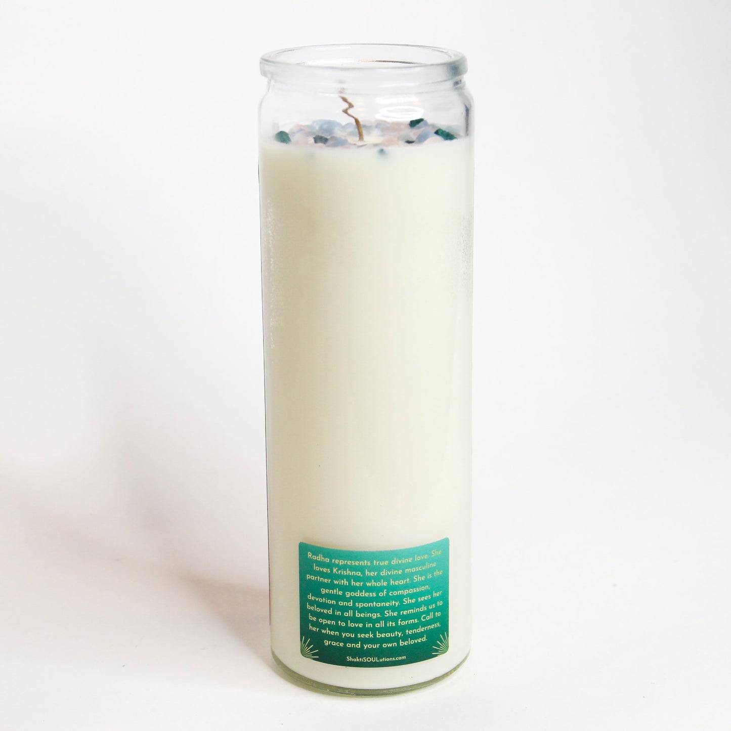 Radha Crystal Altar Candle in a 16 oz glass tumbler with an image of the goddess Radha on the label and rose quartz set into the wax — product photo 4