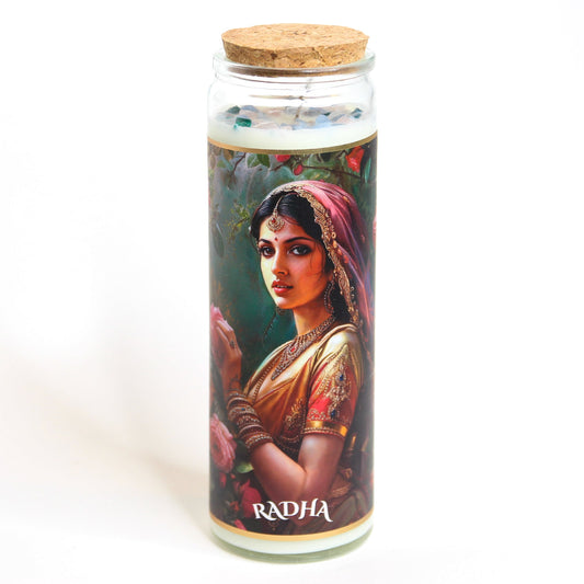 Radha Crystal Altar Candle in a 16 oz glass tumbler with an image of the goddess Radha on the label and rose quartz set into the wax