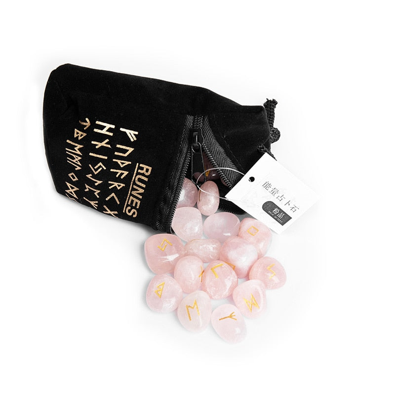 Set of twenty-five carved crystal runes laid out beside a velvet drawstring storage bag — product photo 5