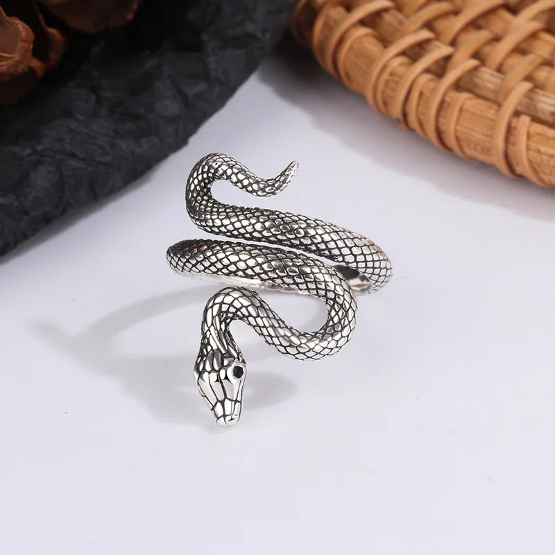 Adjustable sterling silver snake ring coiled around a finger form — view 5 of 5