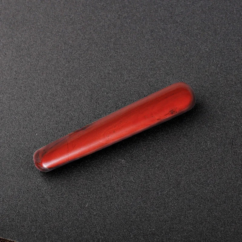 Smooth polished crystal massage wand in assorted gemstones on a dark surface — view 12 of 12
