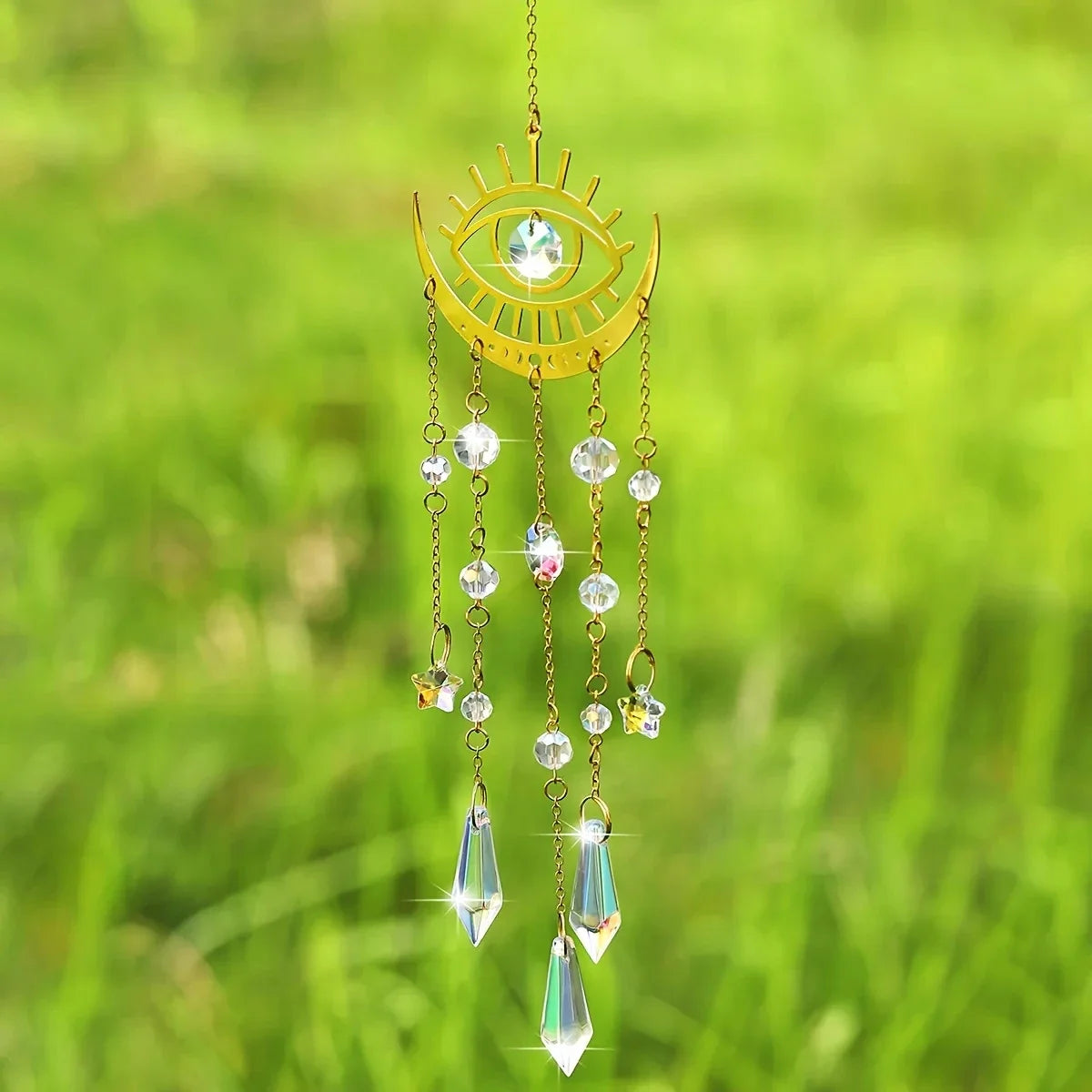 Gold moon phase and sun crystal suncatcher hanging in a window, with faceted K9 crystal prisms — product photo 3