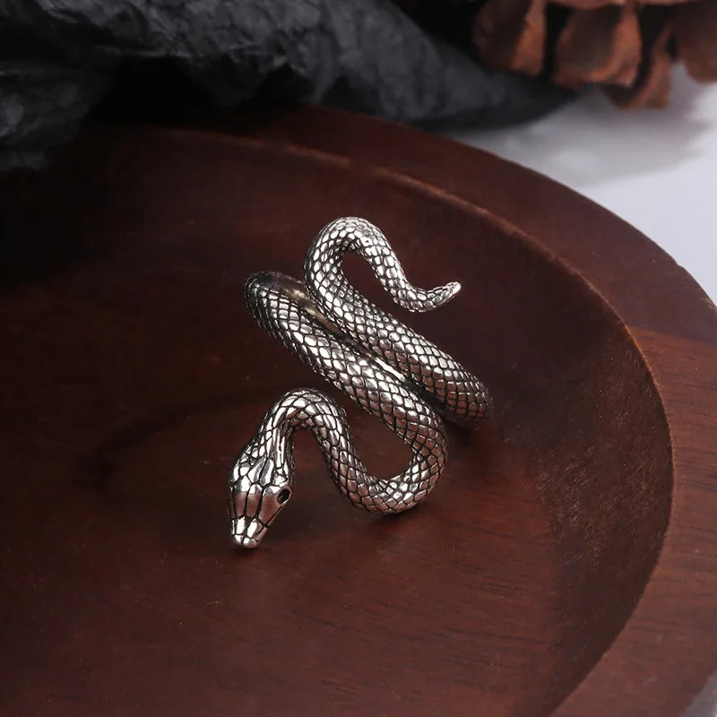 Adjustable sterling silver snake ring coiled around a finger form — view 4 of 5