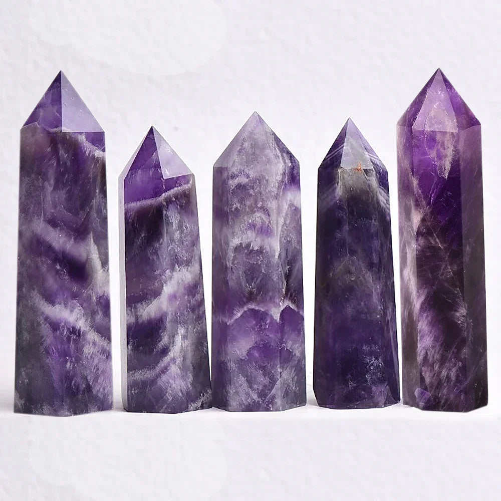 Four-sided polished crystal obelisk tower standing upright on a dark surface — view 3 of 9