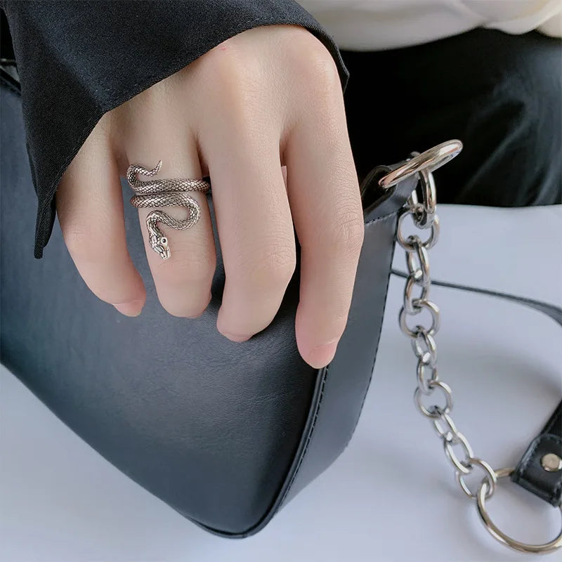 Adjustable sterling silver snake ring coiled around a finger form — view 2 of 5