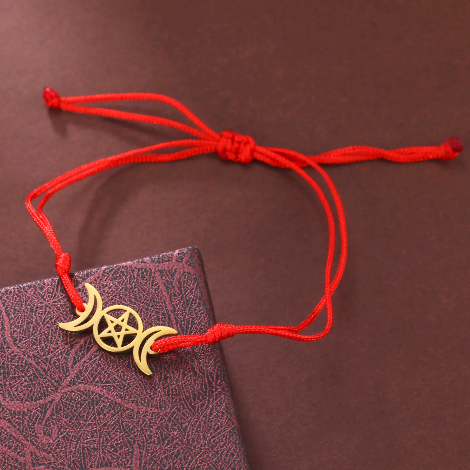 Triple moon pentacle charm in stainless steel on an adjustable lace-up cord bracelet — view 10 of 13