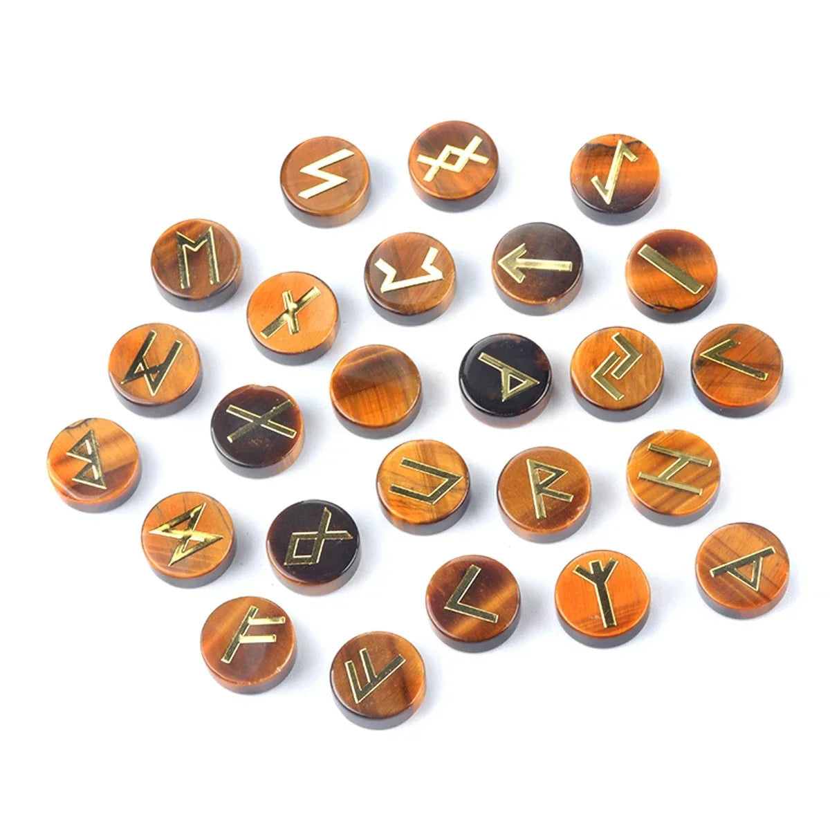 Set of round polished crystal runes engraved with runic symbols, scattered on a dark surface — view 5 of 12