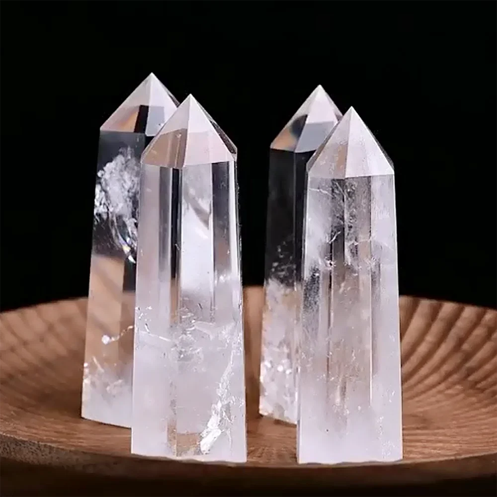 Four-sided polished crystal obelisk tower standing upright on a dark surface — view 4 of 9