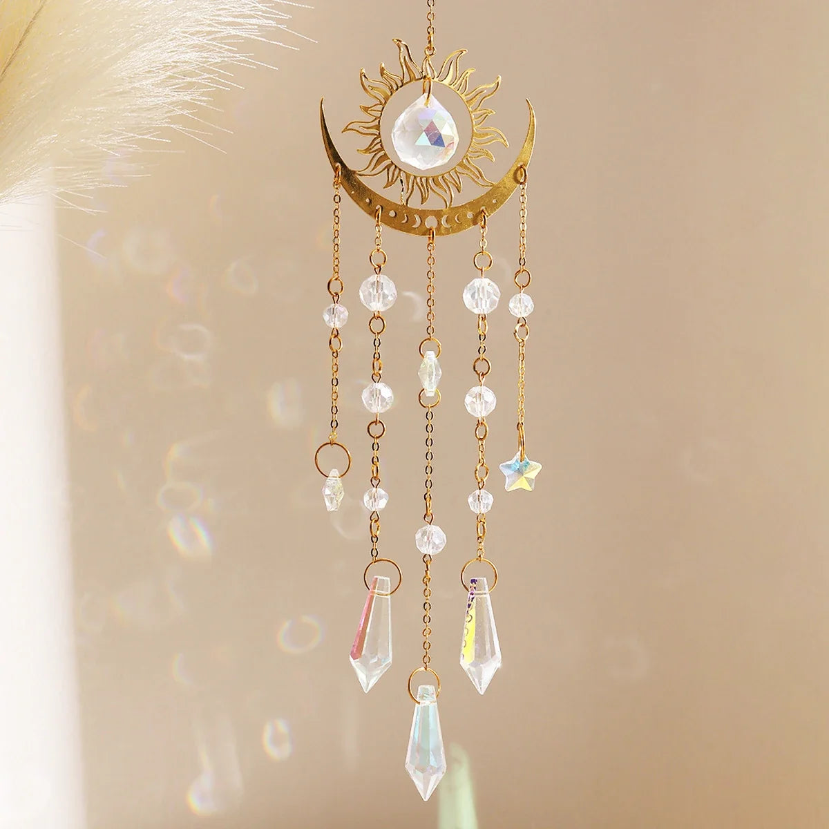 Gold moon phase and sun crystal suncatcher hanging in a window, with faceted K9 crystal prisms — product photo 4