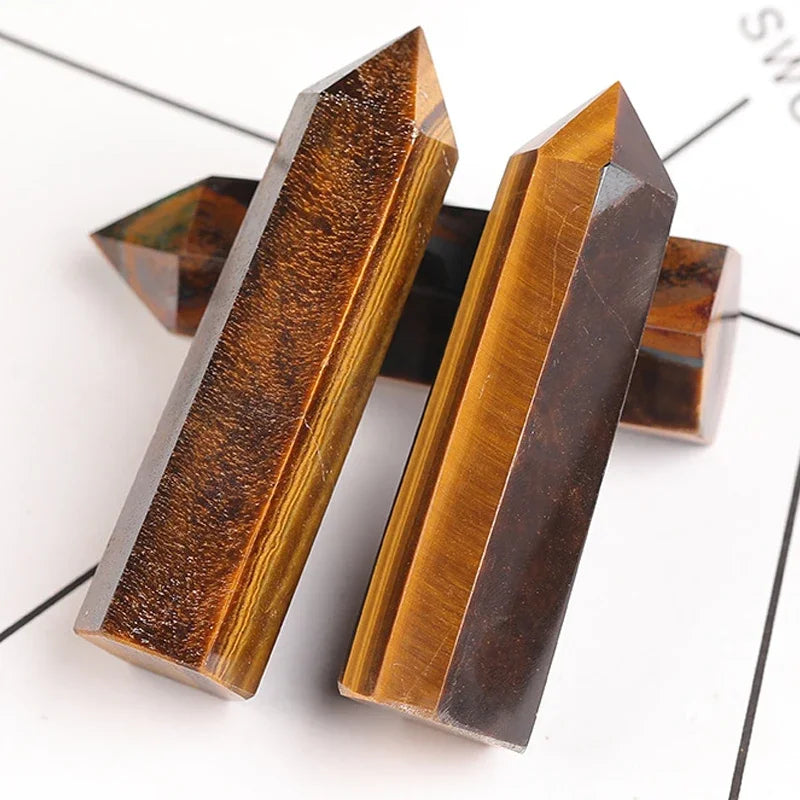 Four-sided polished crystal obelisk tower standing upright on a dark surface — view 8 of 9