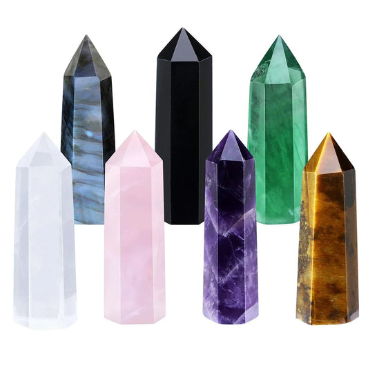 Four-sided polished crystal obelisk tower standing upright on a dark surface — view 1 of 9