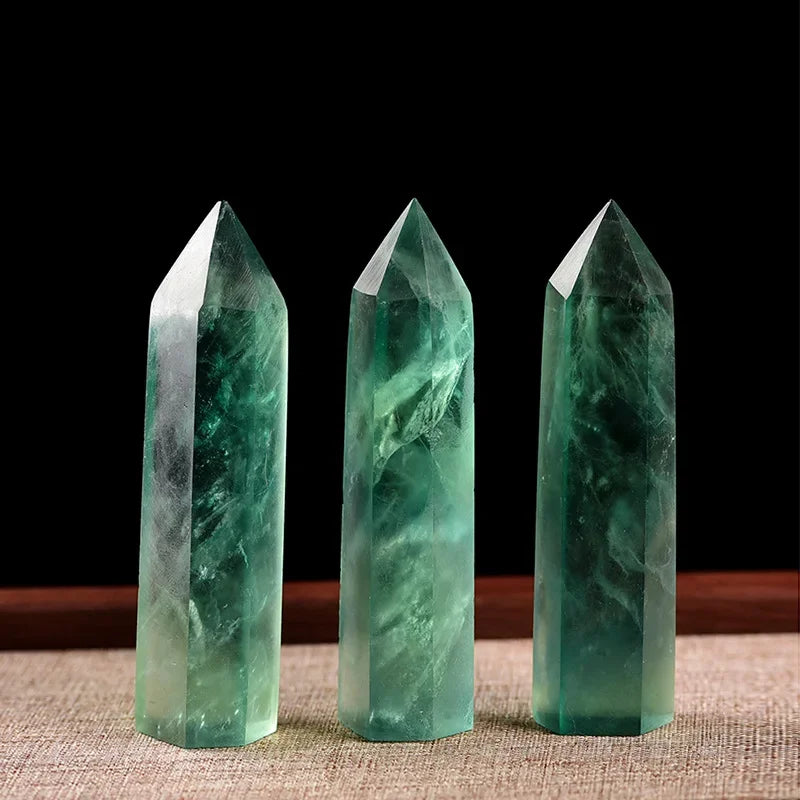 Four-sided polished crystal obelisk tower standing upright on a dark surface — view 2 of 9