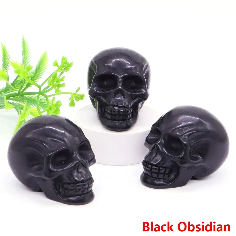 Carved gemstone crystal skull sculpture on a dark surface — view 11 of 12