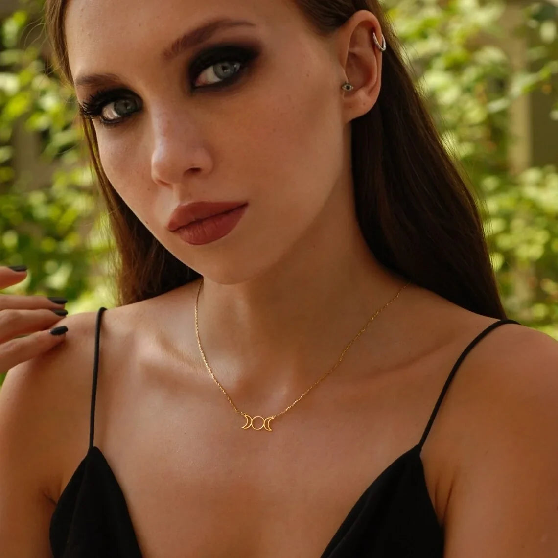 Stainless steel Triple Moon Goddess pendant necklace showing waxing, full and waning moons on a fine chain — product photo 4